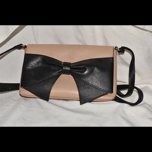 Tan and black Kate Spade Crossbody with a bow